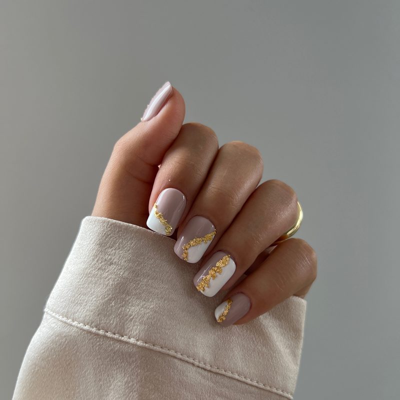 applying foil nail art glue on nails for foil nail application