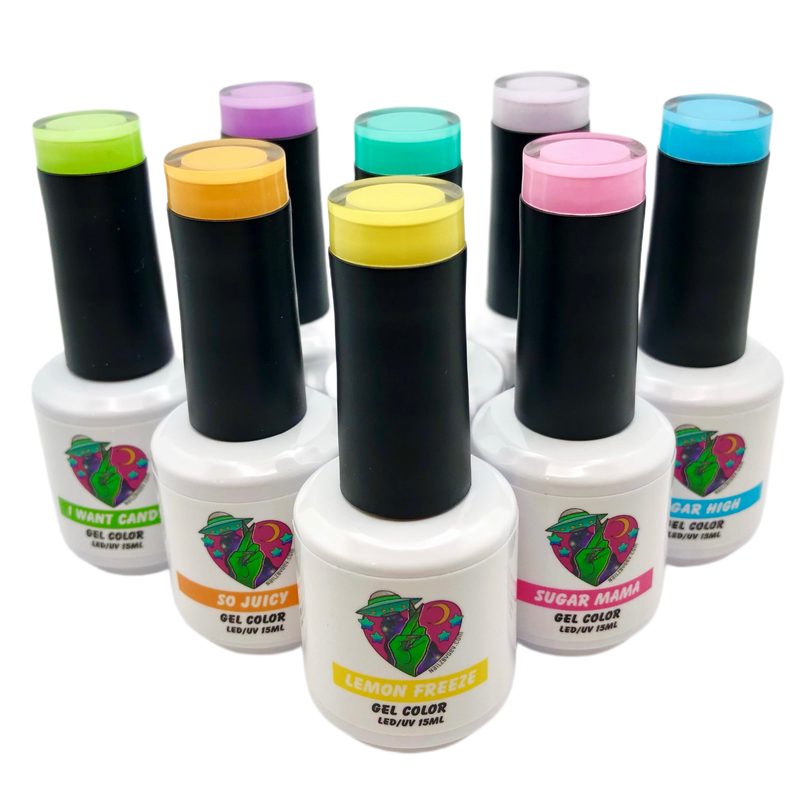 assorted gel nail art paint bottles arranged by color