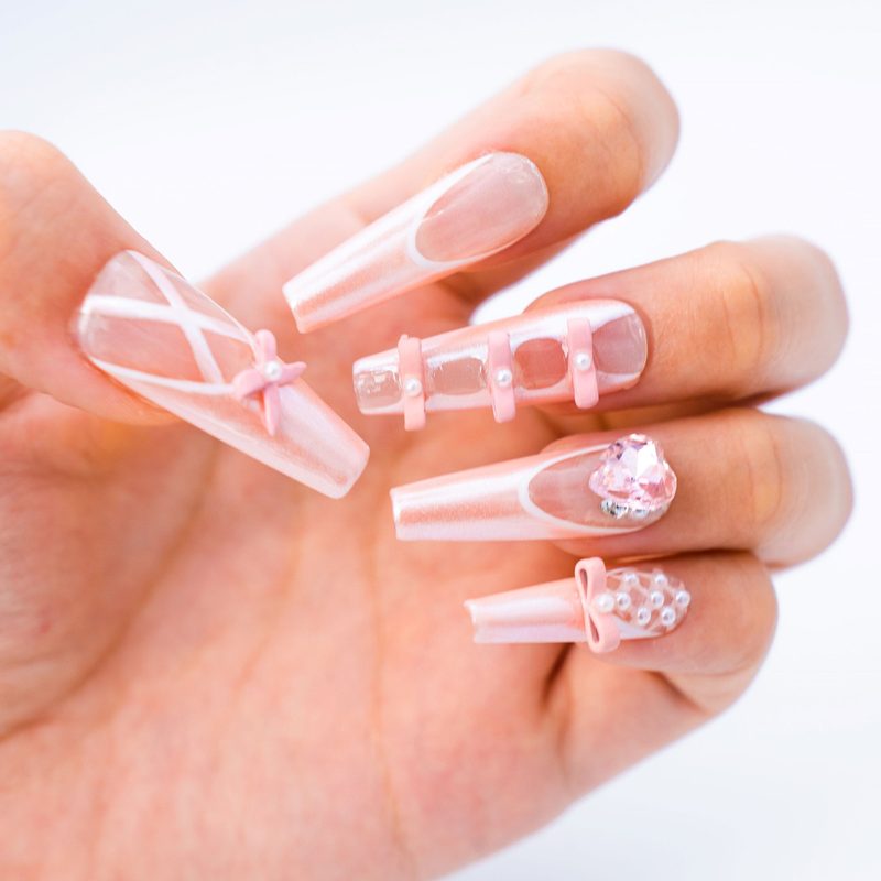 close-up of pink ribbon nail art symbolizing breast cancer awareness