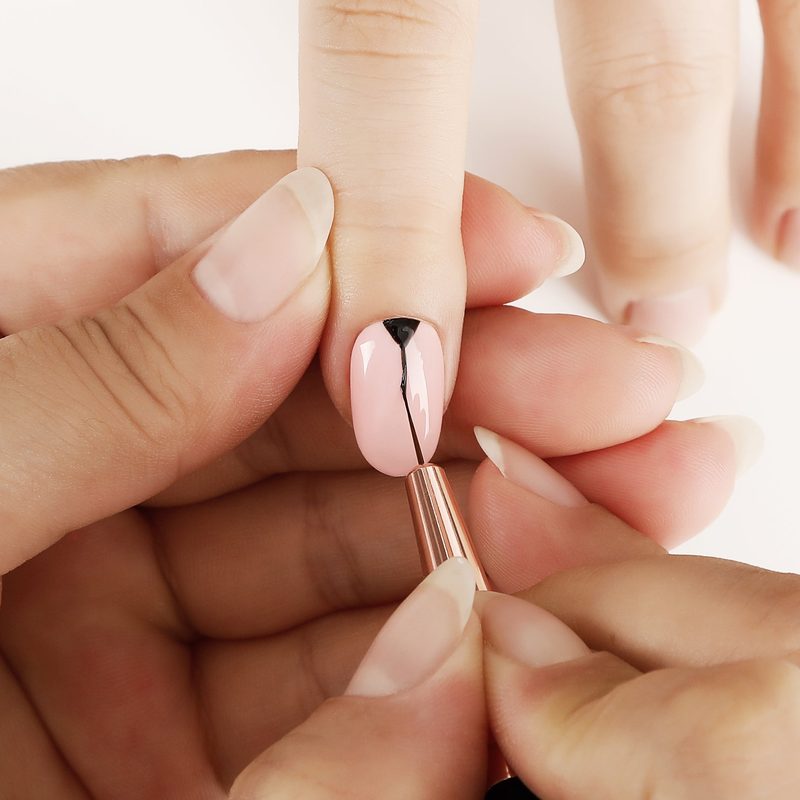 close-up of professional nail art brushes arranged neatly
