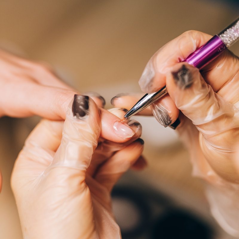 close up of professional quality nail art supplies including gel polish and brushes