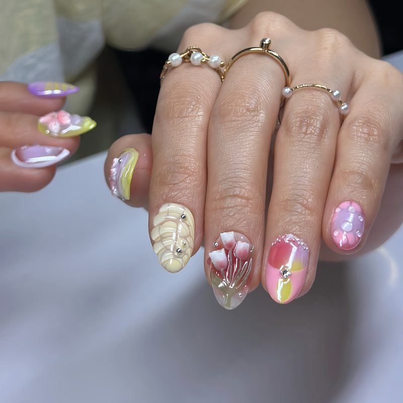 cute pastel nail art with floral and dot accents