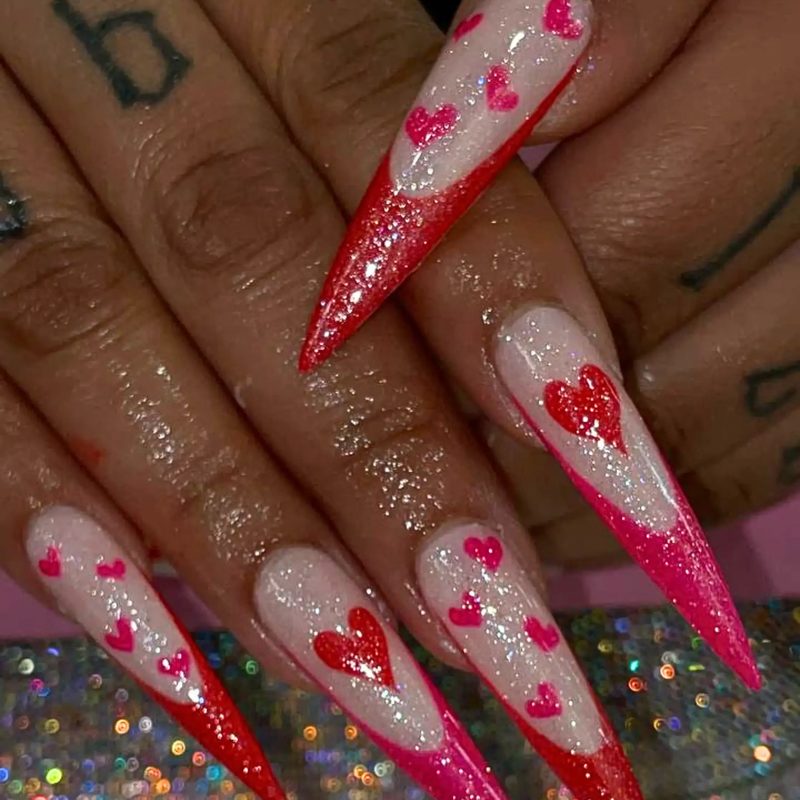 Nail technician applying blue silver nail art at a professional salon