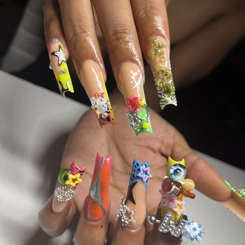 professional nail art with subtle breast cancer awareness design