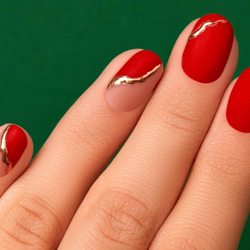 various fall nail art stickers featuring pumpkins, leaves, and plaid patterns on nails