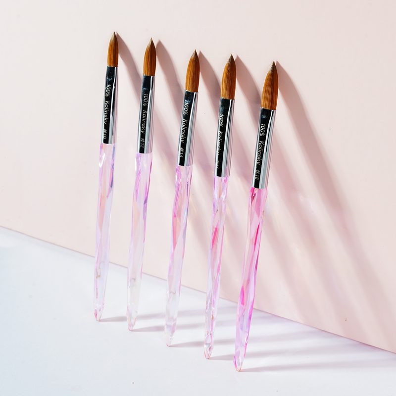 A fine nail art brush next to a gelish nail art kit for detailed manicure designs