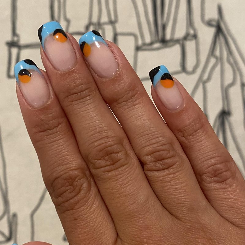 abstract nail art blending color blocking with fluid shapes
