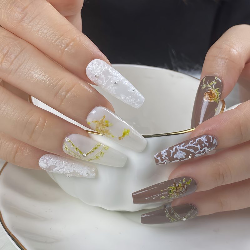 abstract nail art featuring foil accents and stamping techniques
