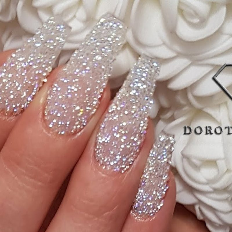 applying swarovski crystals using nail art brush