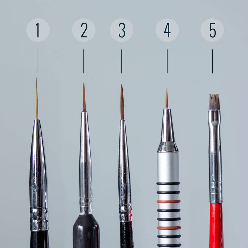 close-up of a beginner selecting high-quality nail art brushes