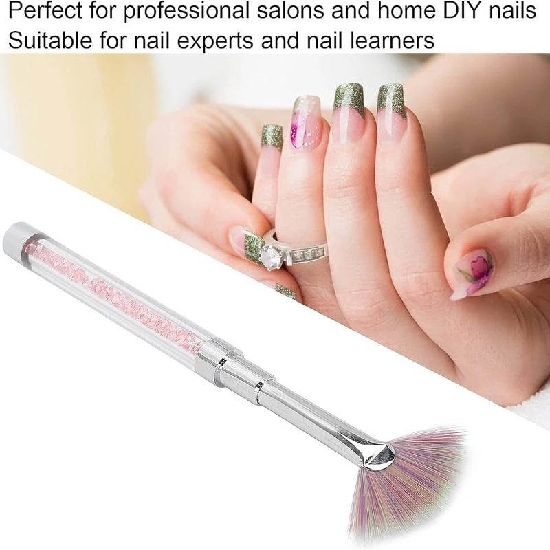 Close-up of fan brush alongside other nail art brushes