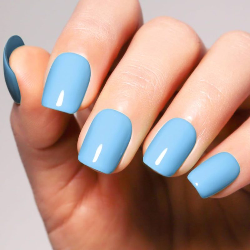close-up of gel nail art blue showing glossy, long-lasting finish
