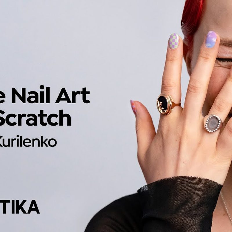 close-up of hands following nail art online course tutorial