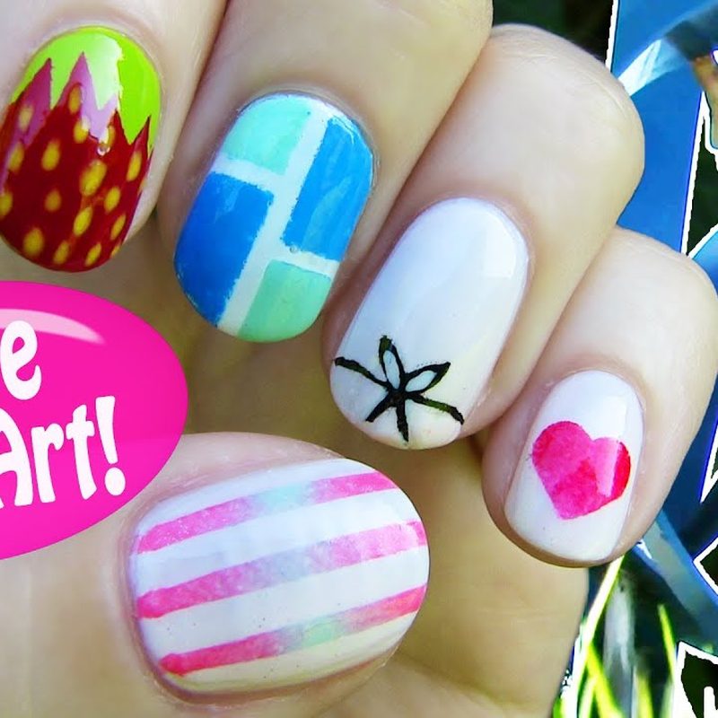 close-up of nail art detailing with brush liner and scotch tape