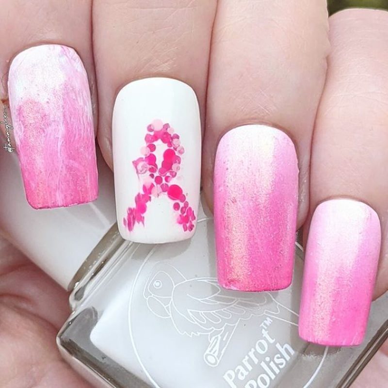 close-up of pink ribbon manicure symbolizing breast cancer awareness