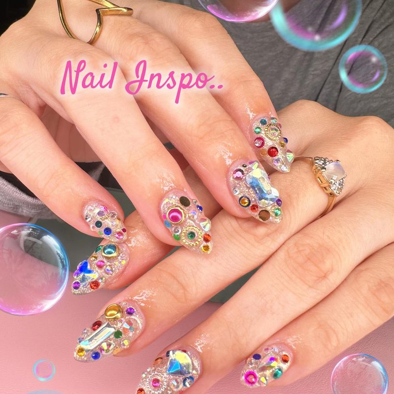 close-up of sparkling gems for nail art on manicured nails