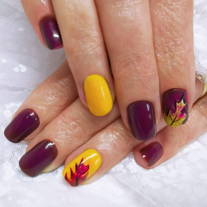 colorful abstract nail art with bold and pastel colors