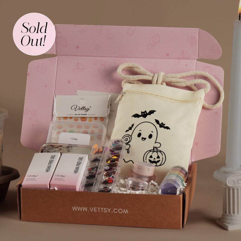 contents of a nail art subscription box showing polish, brushes, and decorations