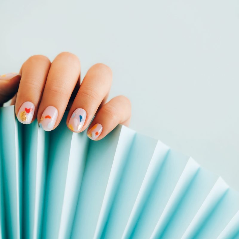 creative nail art featuring detailed line designs and accents