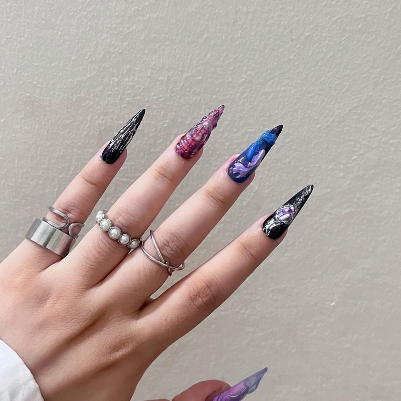 Custom astrology nails featuring Pisces symbols and modern design elements