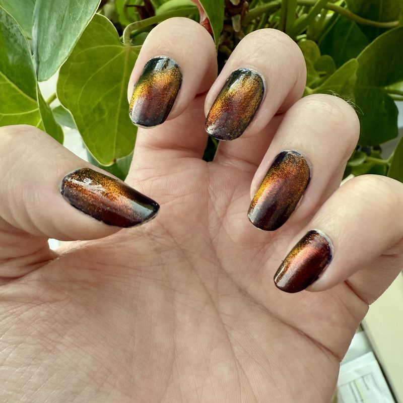 festive jack o lantern nail art showing pumpkin faces with fall colors