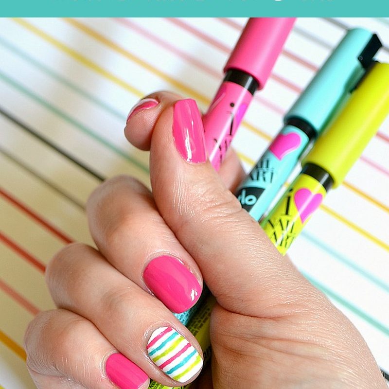 hand demonstrating step-by-step nail art design using nail art pen nail polish