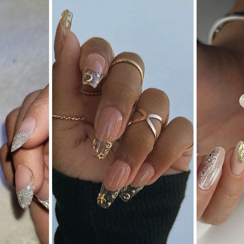 hand displaying trendy nail art with stacked rings and crystals