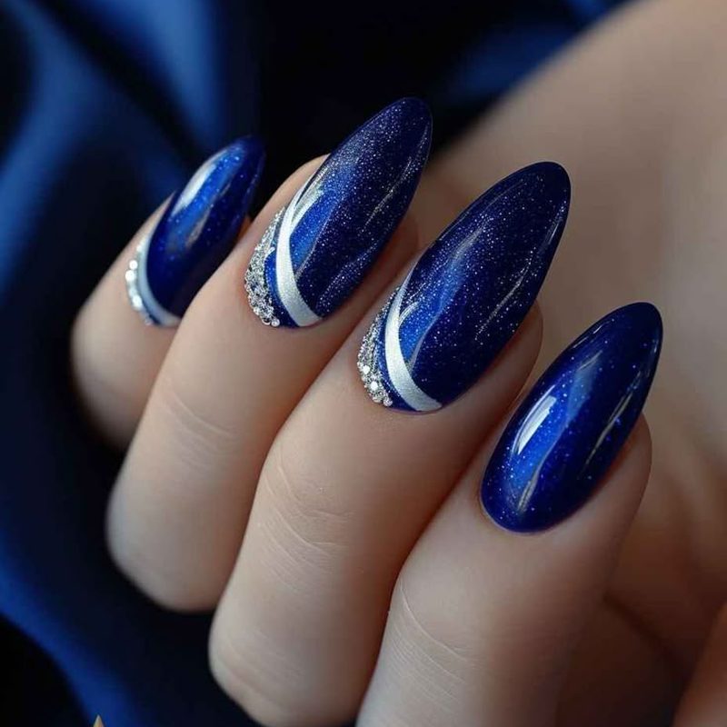 intricate blue and silver nail art designs with geometric patterns