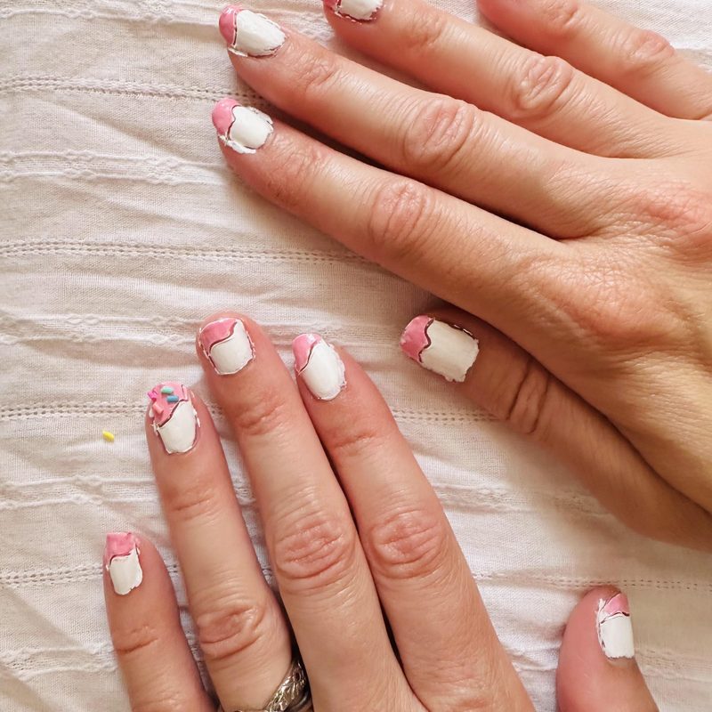 manicure tools arranged on a silicone mat from a nail polish art set
