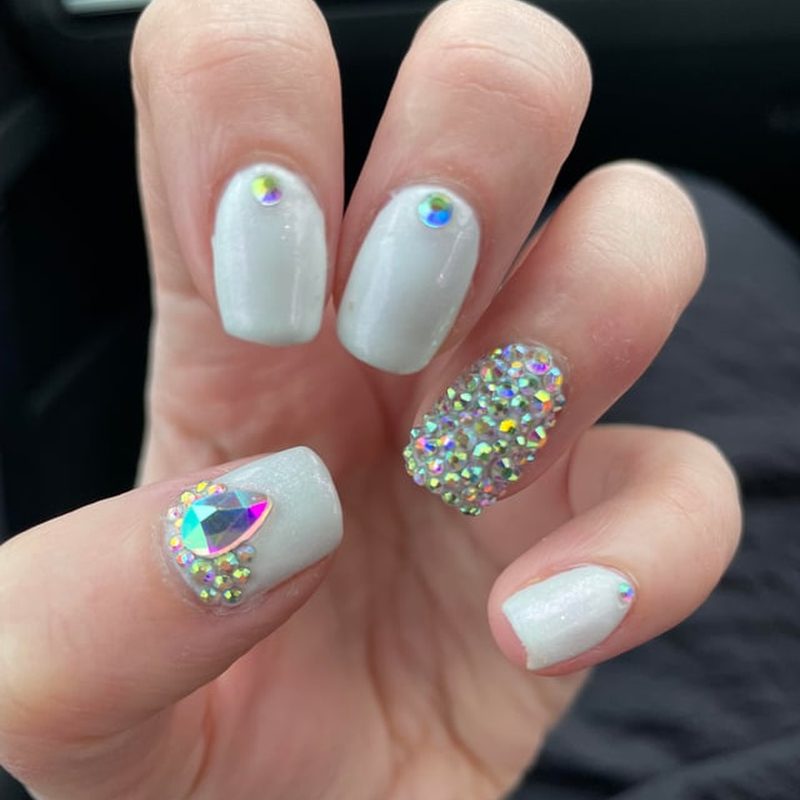 manicure with rhinestones falling off due to poor glue application
