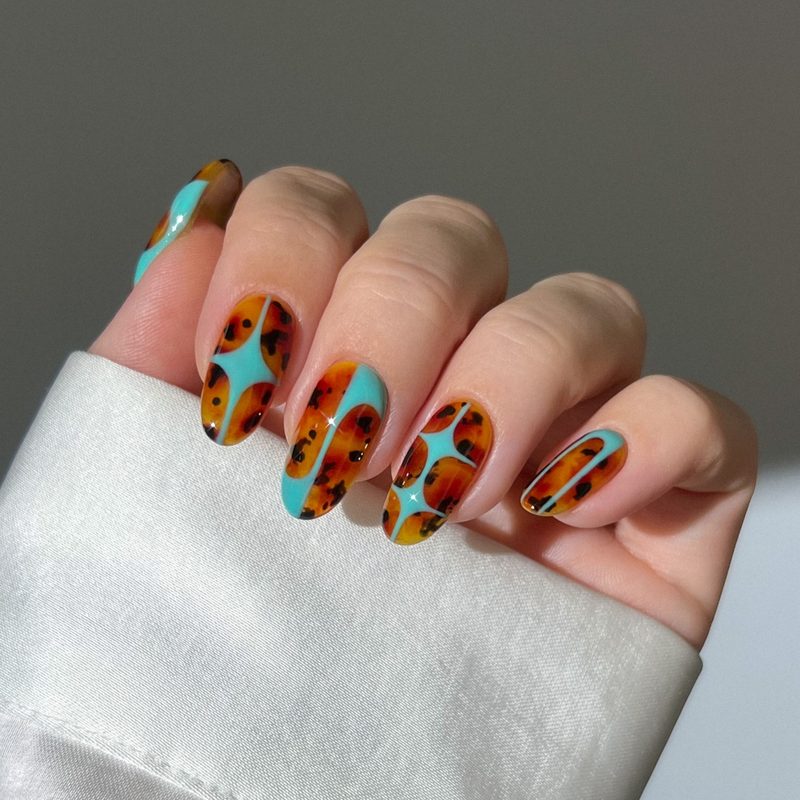 modern nail designs featuring abstract shapes and colors