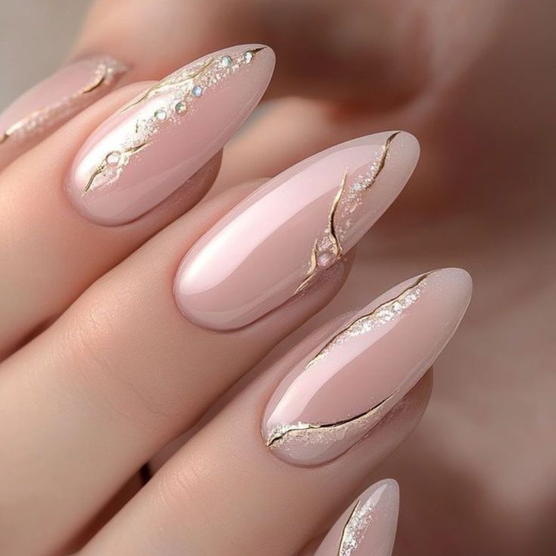 modern nude nails featuring metallic foil nail art