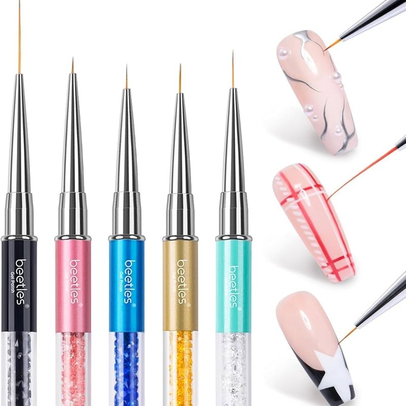 nail art brushes and gel palette for jewelry-inspired manicure