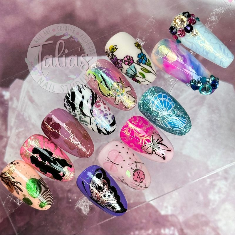 nail art tools including 3D brushes and stamping plates displayed together