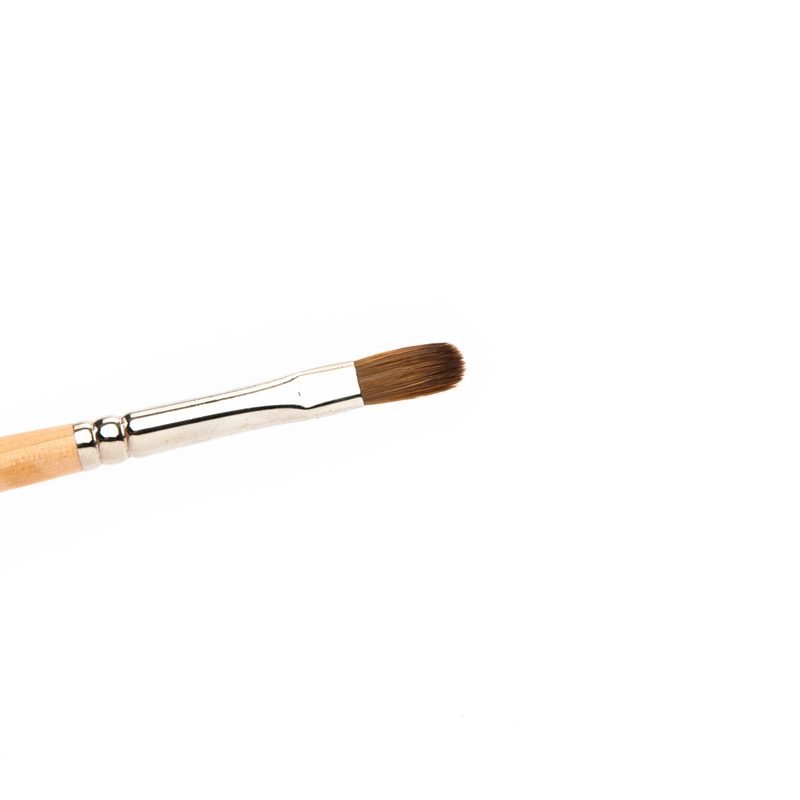 nail artist using a flat brush to paint detailed nail art