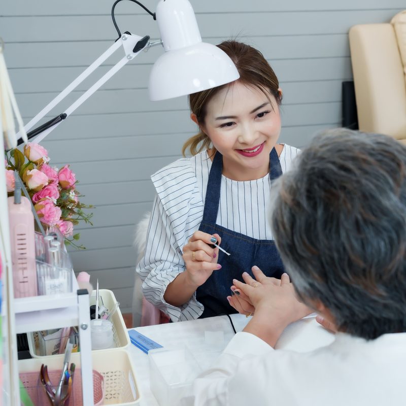 nail salon professionals delivering manicure services