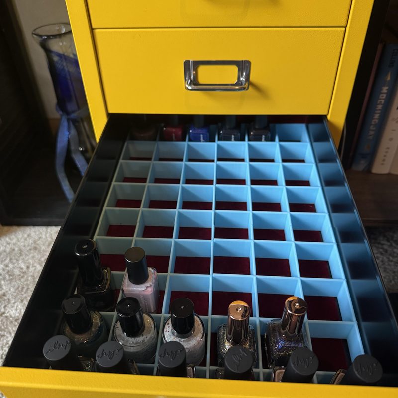 organized storage of 3d nail art supplies with labeled containers and silicone mat