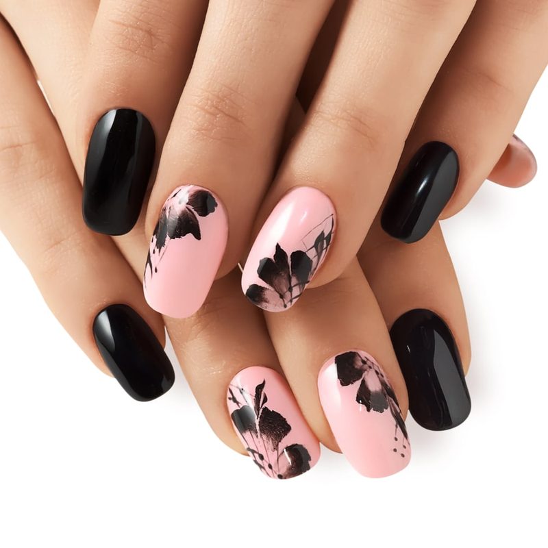 person comparing nail art online courses on laptop