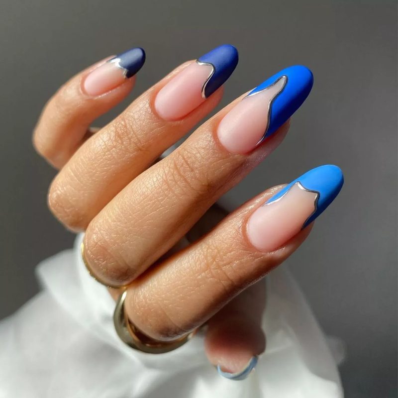 variety of gel nail art blue designs featuring ombre and glitter accents