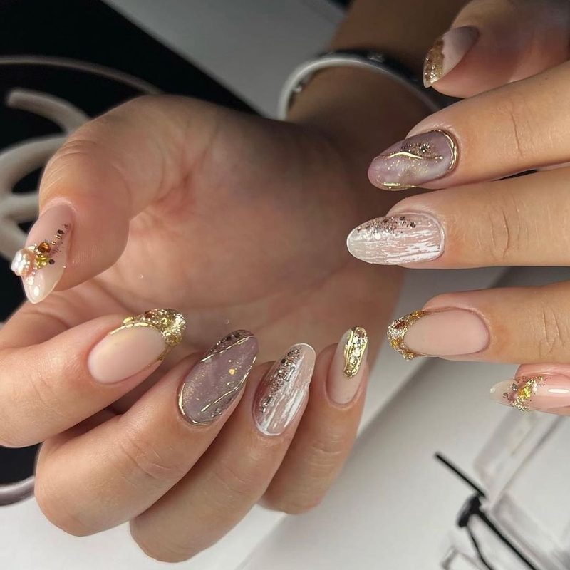 various trendy nail foil designs including geometric and floral