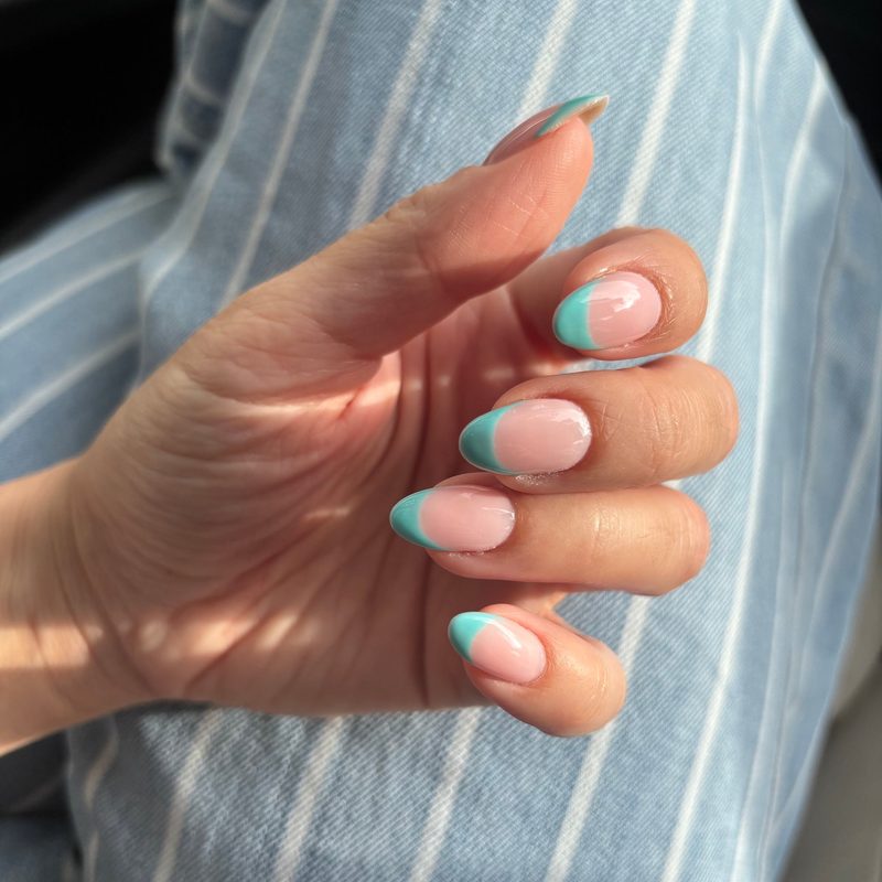 Well-maintained delicate nail art manicure with glossy topcoat