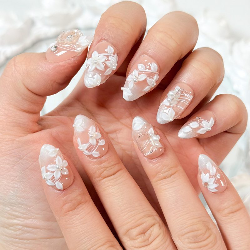 white nail art polish bridal manicure with delicate floral accents