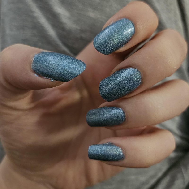 woman using nail art stamping plates and stamper for manicure designs