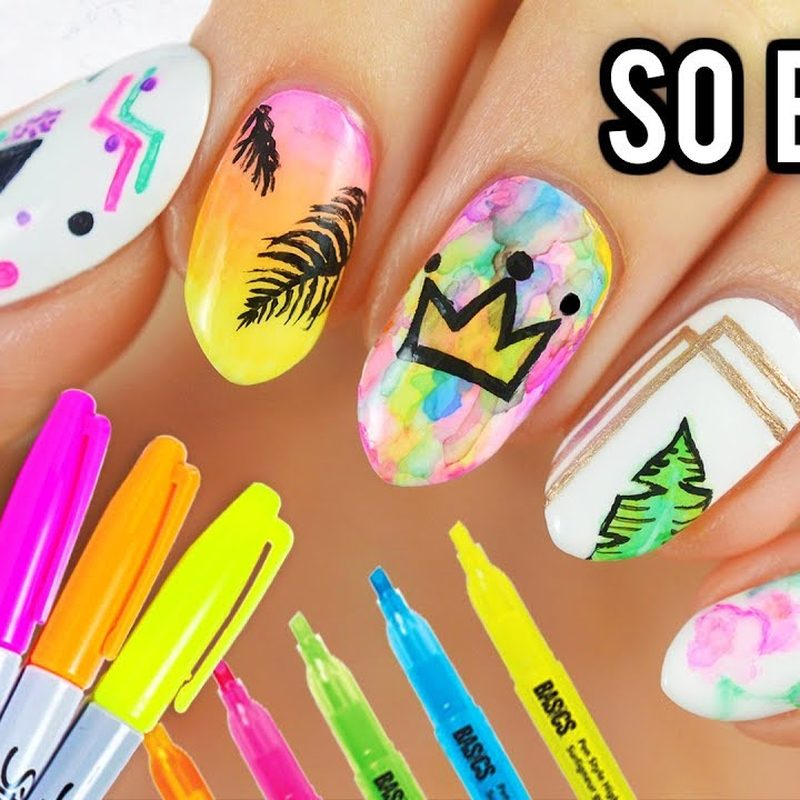 artist using best nail art markers to create intricate nail art designs