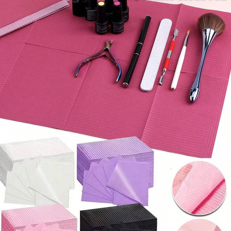 clean and organized nail salon workspace featuring disposable mats