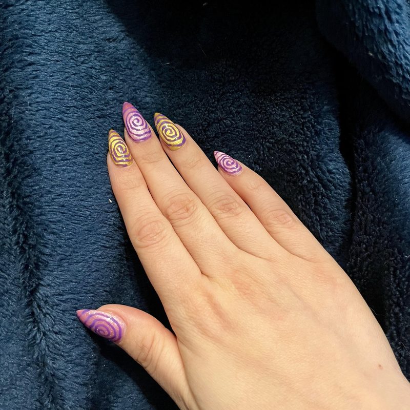 close up of gel pen nail art showing precision nail designs