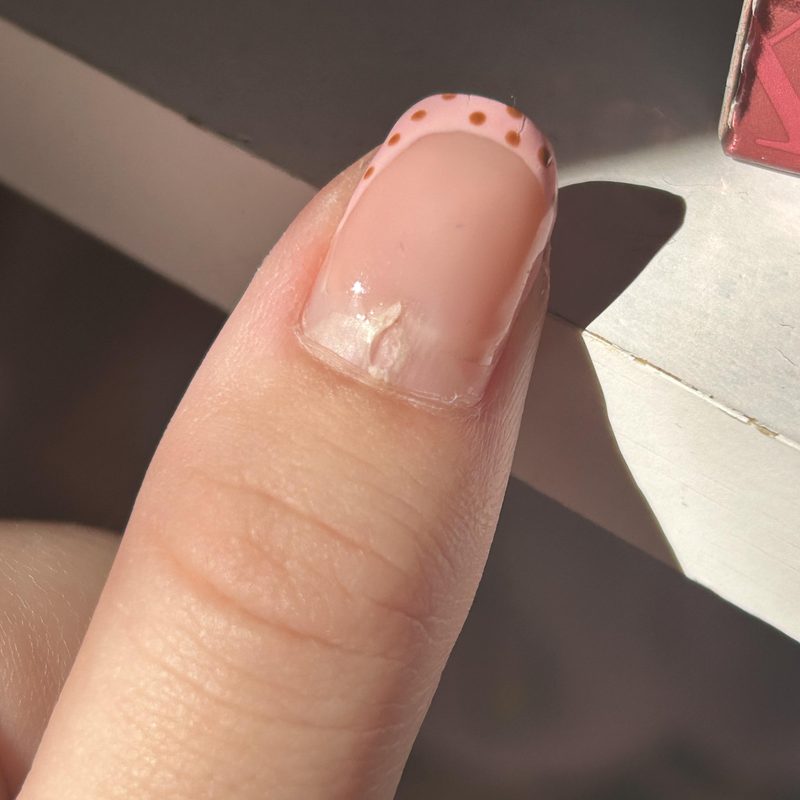 close-up of hands receiving nail care for manicure maintenance