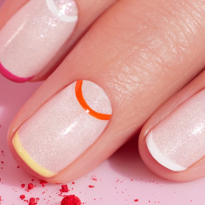 close-up of nail art kit components including brushes, polishes, and tools