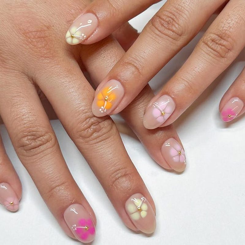 close-up of nails painted with vibrant gel nail polish