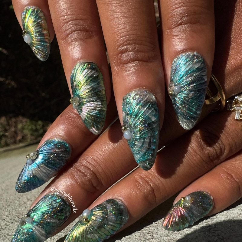 close-up of nails with fine nail art glitter enhancing manicure sparkle